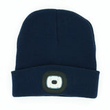 Navy blue beanie with a light on a white background