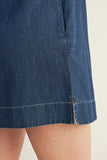Close-up of a blue denim skirt on a plain background