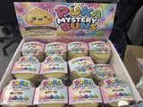 Box of Puka Mystery Buns with colorful packaging and small containers.