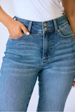 Close-up of blue jeans with a white background