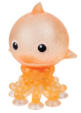 Small figurine of a creature with a round body and tentacles on a white background