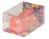 Colorful axolotl  in a clear box with a patterned interior