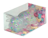 Colorful toy axolotl squish 
in a clear box with a multicolored base