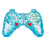 A translucent blue game controller filled with white glitter, featuring red thumbsticks, yellow and green buttons, and a blue directional pad on a white background.