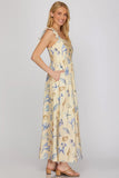 Woman wearing a floral dress on a plain background