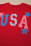 Red shirt with 'USA' printed in blue and white stars on a beige background