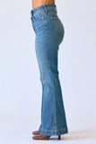 Blue jeans being worn on a white background