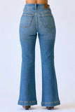 Blue jeans with a flared design on a white background