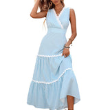 Woman wearing a blue and white striped dress on a white background