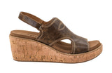 Brown wedge sandal with cork sole on a white background