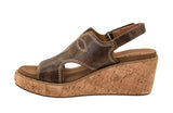 Brown wedge sandal with cork sole on a white background