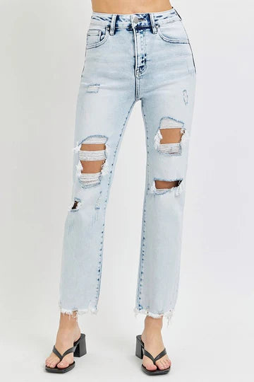 Light blue ripped jeans on a white background