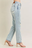 Light blue jeans with a distressed design worn by a person on a neutral background