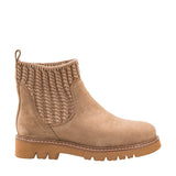 A light brown suede ankle boot with a textured knit elastic side panel and a chunky lug sole, shown in profile against a white background.