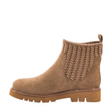 A light brown suede ankle boot with a textured knit elastic side panel and a chunky lug sole, shown in profile against a white background.