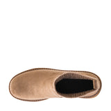 A top-down view of a beige suede ankle boot with a black interior lining and brown stitching, set against a plain white background.