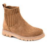 A single ankle boot in tan suede with a ribbed knit elastic side panel and a chunky lug sole, shown on a plain white background.
