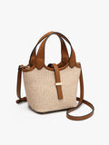 Woven handbag with brown leather straps on a white background