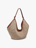 Beige woven handbag with brown leather straps on a white background