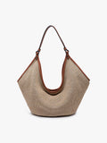 Beige handbag with a strap on a neutral background