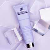 Naked Bee skincare tube on a light purple geometric background