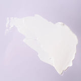 White sunscreen on a light purple background