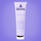 Tube of The Naked Bee skincare product on a purple background