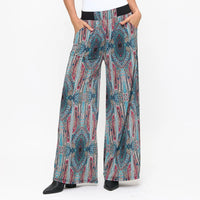 Colorful patterned pants worn by a person on a white background
