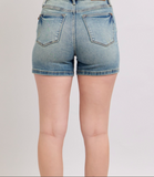 Denim shorts on a plain background
