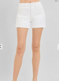 White shorts worn by a person on a plain background