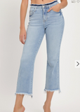 Light blue jeans worn by a person on a white background