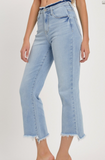 Light blue jeans worn by a person on a plain background