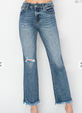 Blue jeans with slight distressing on a white background