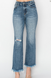 Distressed blue jeans on a white background
