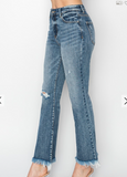 Blue jeans with frayed hems on a white background