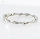 Silver bangle on a white background
