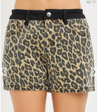 Leopard print shorts with a black waistband on a white background