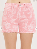 Pink floral shorts on a white background