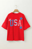 Red t-shirt with 'USA' print on a wooden hanger against a white background