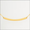 Gold necklace with a curved pendant on a white background
