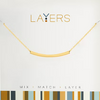Gold necklace on a light gray background with 'LAYERS' branding.
