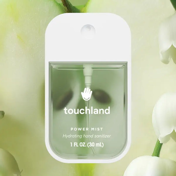 Touchland power mist hand sanitizer with green liquid on a light green background