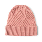 Pink knit beanie on a white background