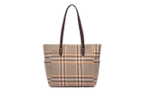 Plaid patterned handbag with brown leather handles on a white background