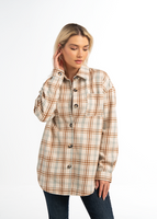 Woman wearing a plaid jacket on a white background