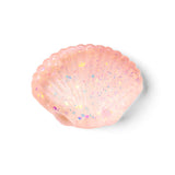 A pink squishy seashell-shaped  filled with iridescent glitter, shown on a clean white background.