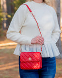 red purse with chain strap