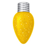 A yellow glitter Christmas bulb light with a silver screw base, isolated on a white background.