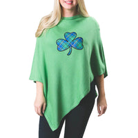 green poncho with plaid shamrock